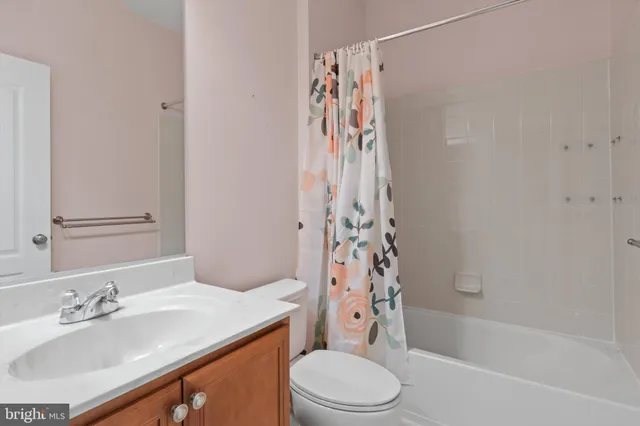 a bathroom with a sink a toilet and a bathtub