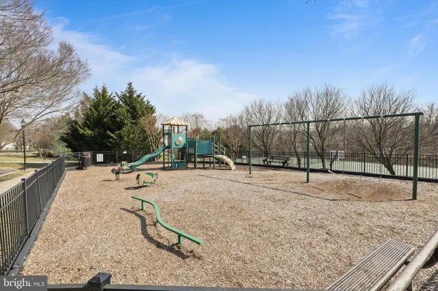 a swimming pool with some trees in the background