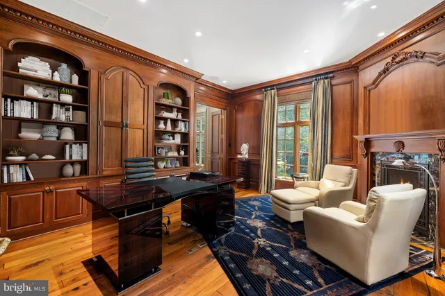 a living room with furniture a rug and a large window