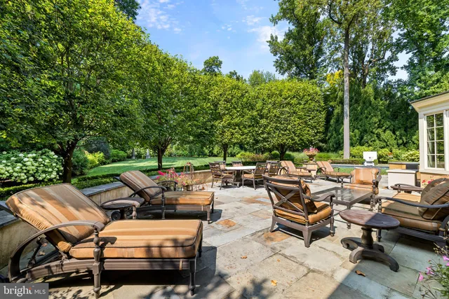 a backyard of a house with outdoor seating