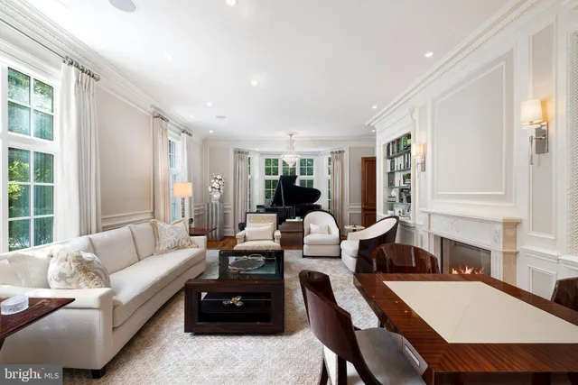 a living room with furniture and fireplace