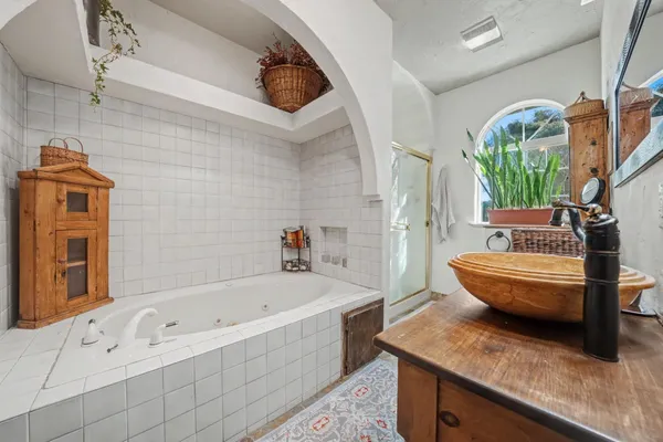 a bathroom with a bathtub sink and toilet