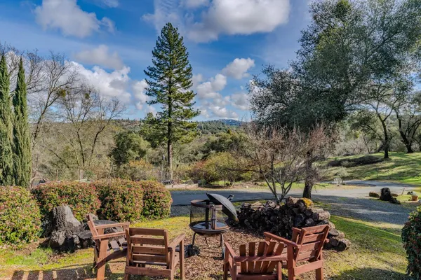 a view of a patio with table and chairs and potted plants