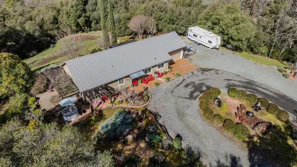 an aerial view of a house with outdoor space