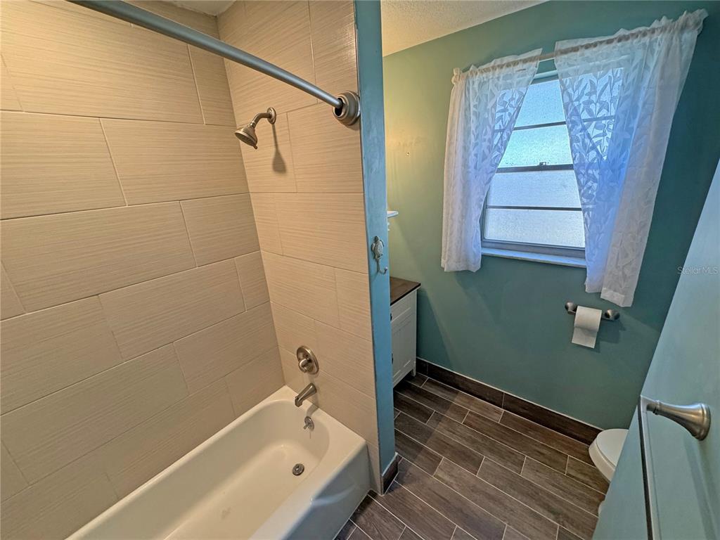 1421 Suwanee Road Daytona Beach, FL 32114 - Photo 17 of 21 a bathroom with a tub and shower