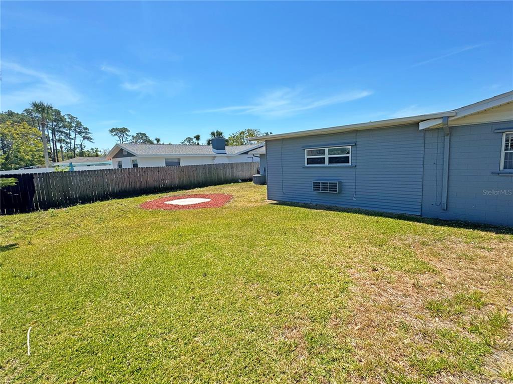 1421 Suwanee Road Daytona Beach, FL 32114 - Photo 19 of 21 a view of a yard with an ocean