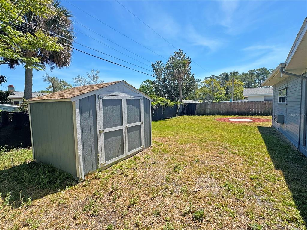 1421 Suwanee Road Daytona Beach, FL 32114 - Photo 21 of 21 a view of a house with a backyard
