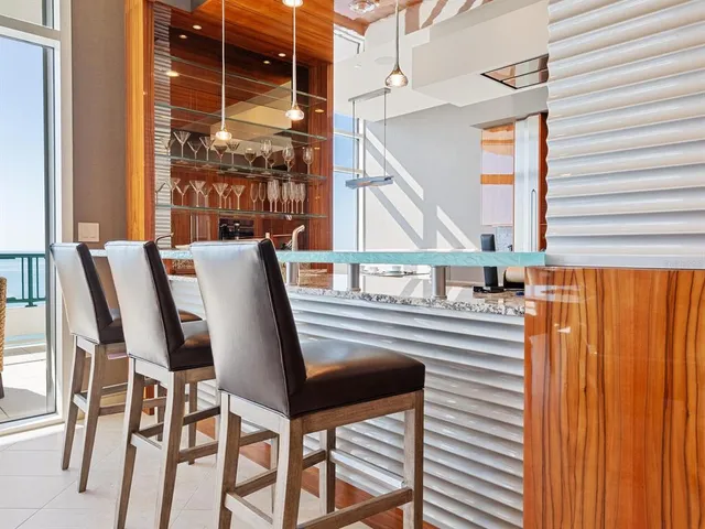 a kitchen with stainless steel appliances granite countertop a stove and a sink