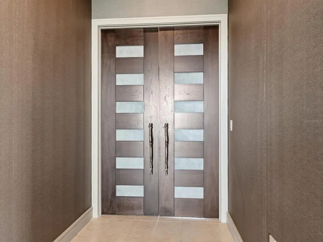 a bedroom with a large bed and a couch