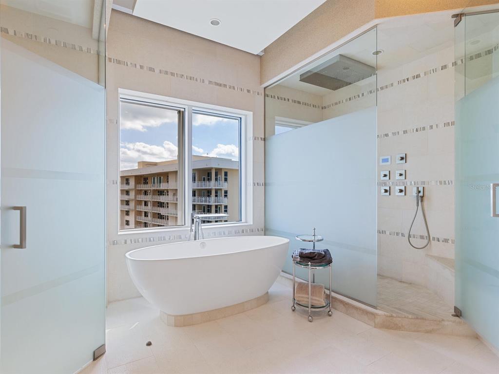 655 Longboat Club Road, Unit 1PH Longboat Key, FL 34228 - Photo 37 of 53 a bathroom with a bathtub and shower