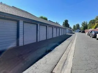 a view of balcony with wooden floor and fence