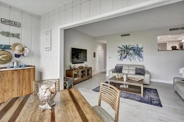 a bedroom with furniture and a wooden floor