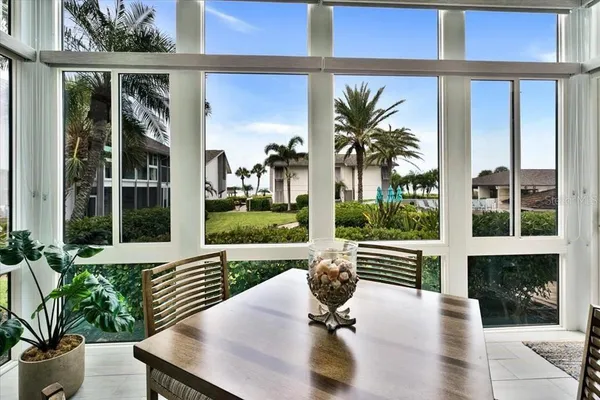 a view of a balcony with lake view and a potted plant