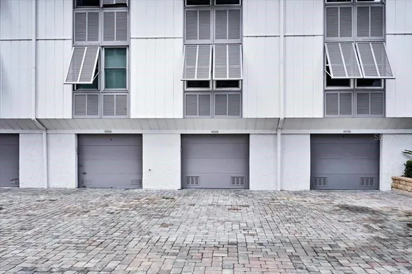 a view of a big room with wooden floor and fence