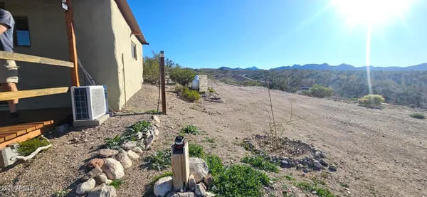 a view of a backyard with mountain view