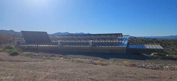 a view of a bench under an umbrella
