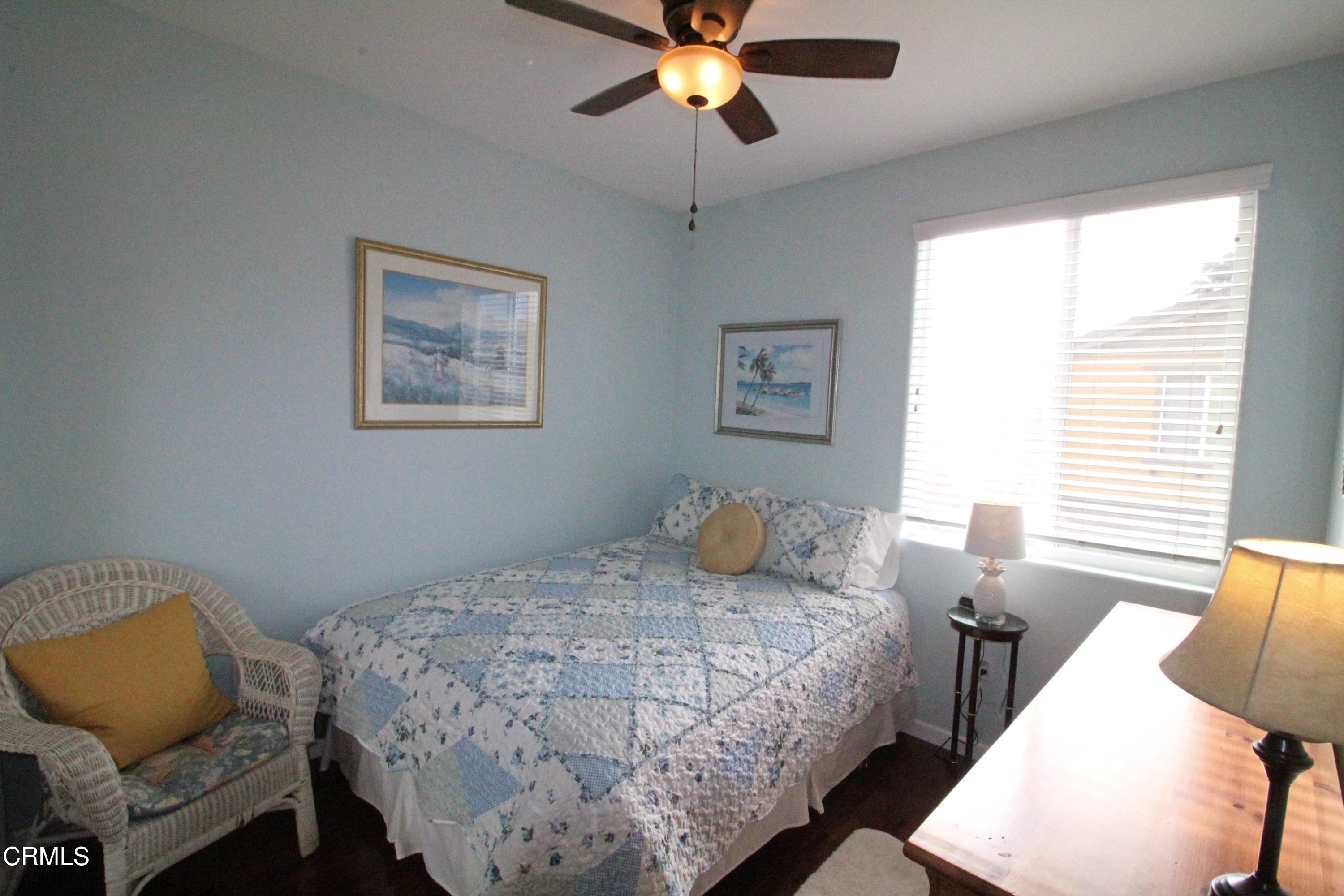 1428 Windshore Way Oxnard, CA 93035 - Photo 14 of 29 a bedroom with a bed and window