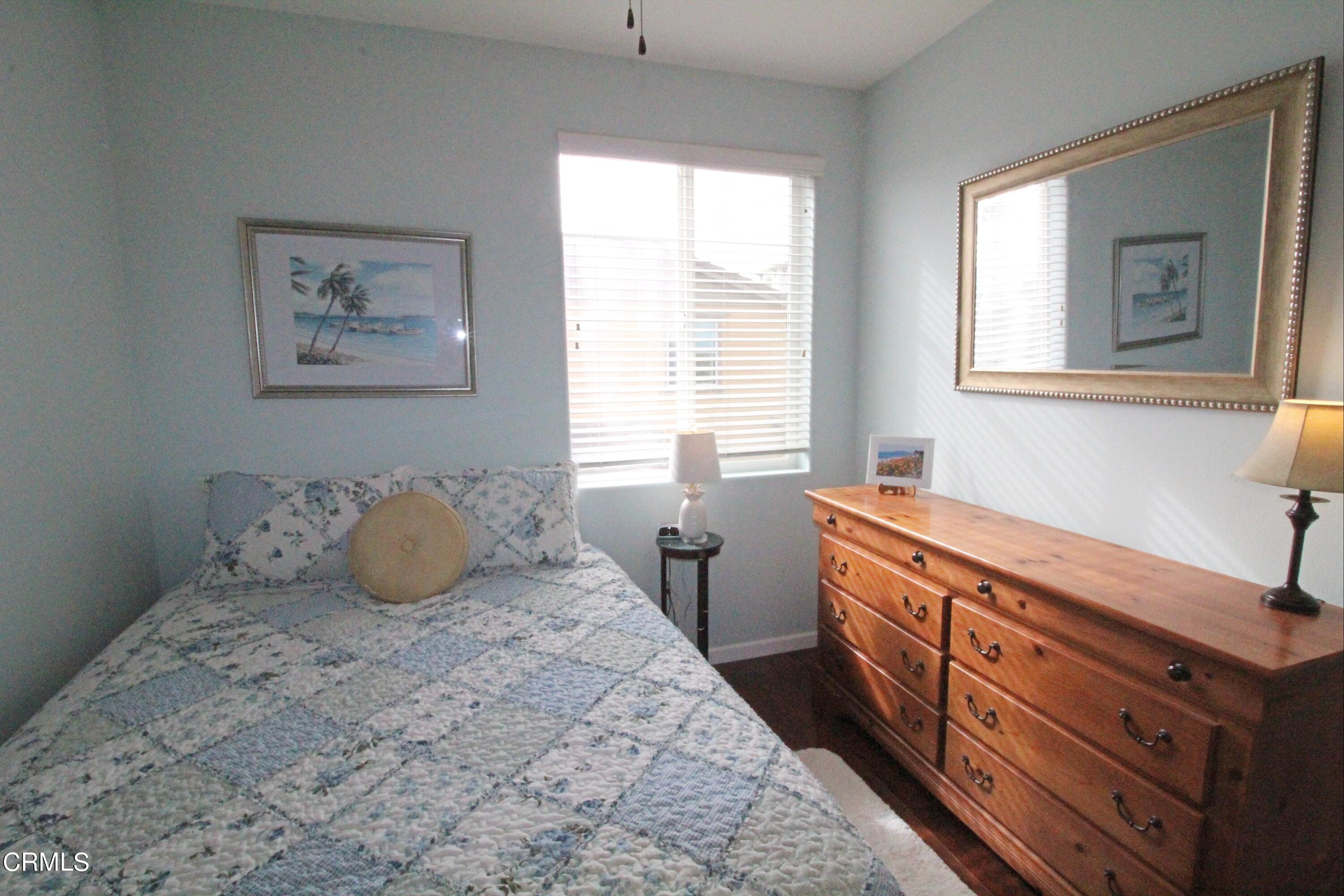 1428 Windshore Way Oxnard, CA 93035 - Photo 15 of 29 a bedroom with a bed and a window