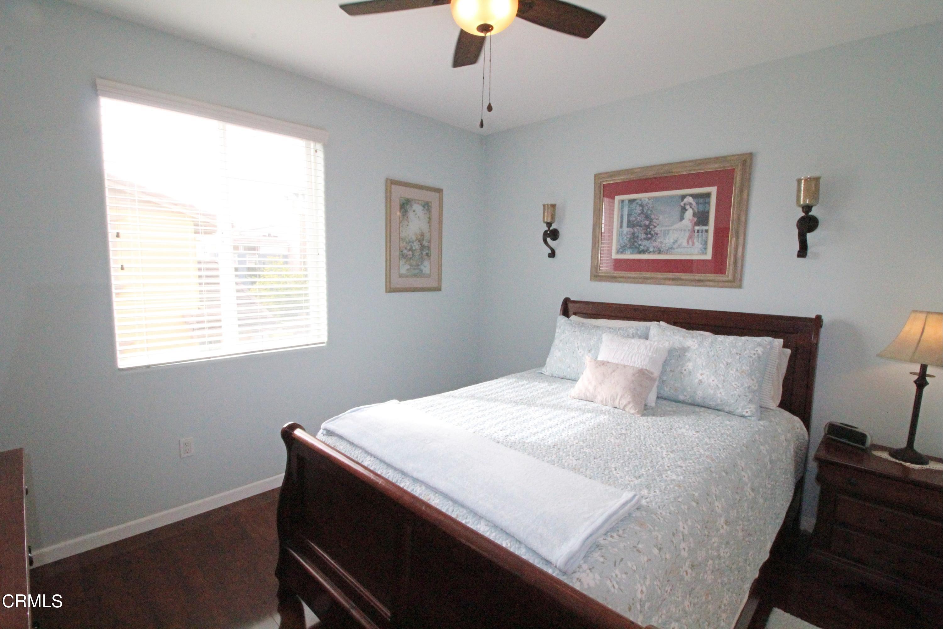 1428 Windshore Way Oxnard, CA 93035 - Photo 19 of 29 a bedroom with a bed and a window