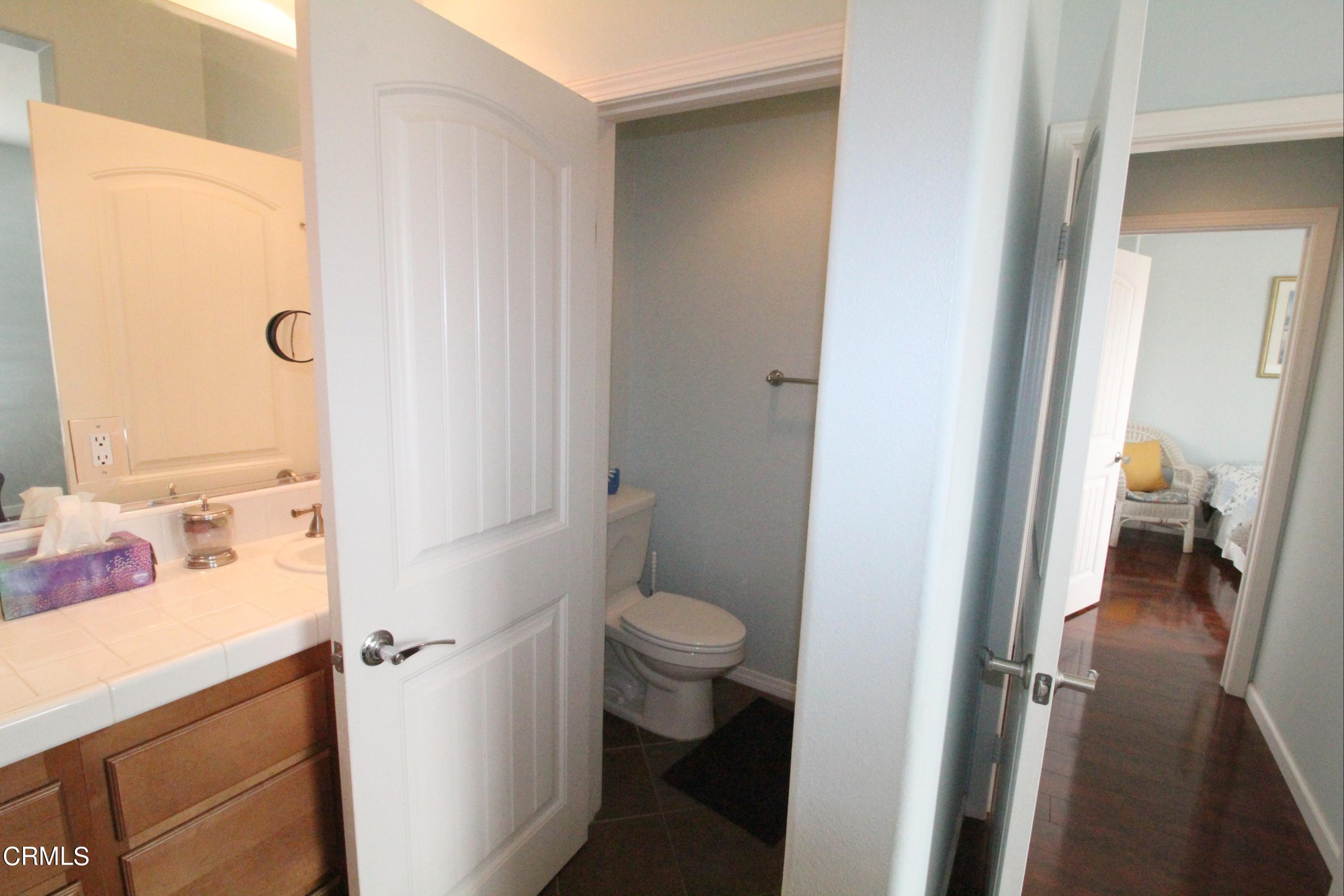 1428 Windshore Way Oxnard, CA 93035 - Photo 24 of 29 a bathroom with a sink and a toilet