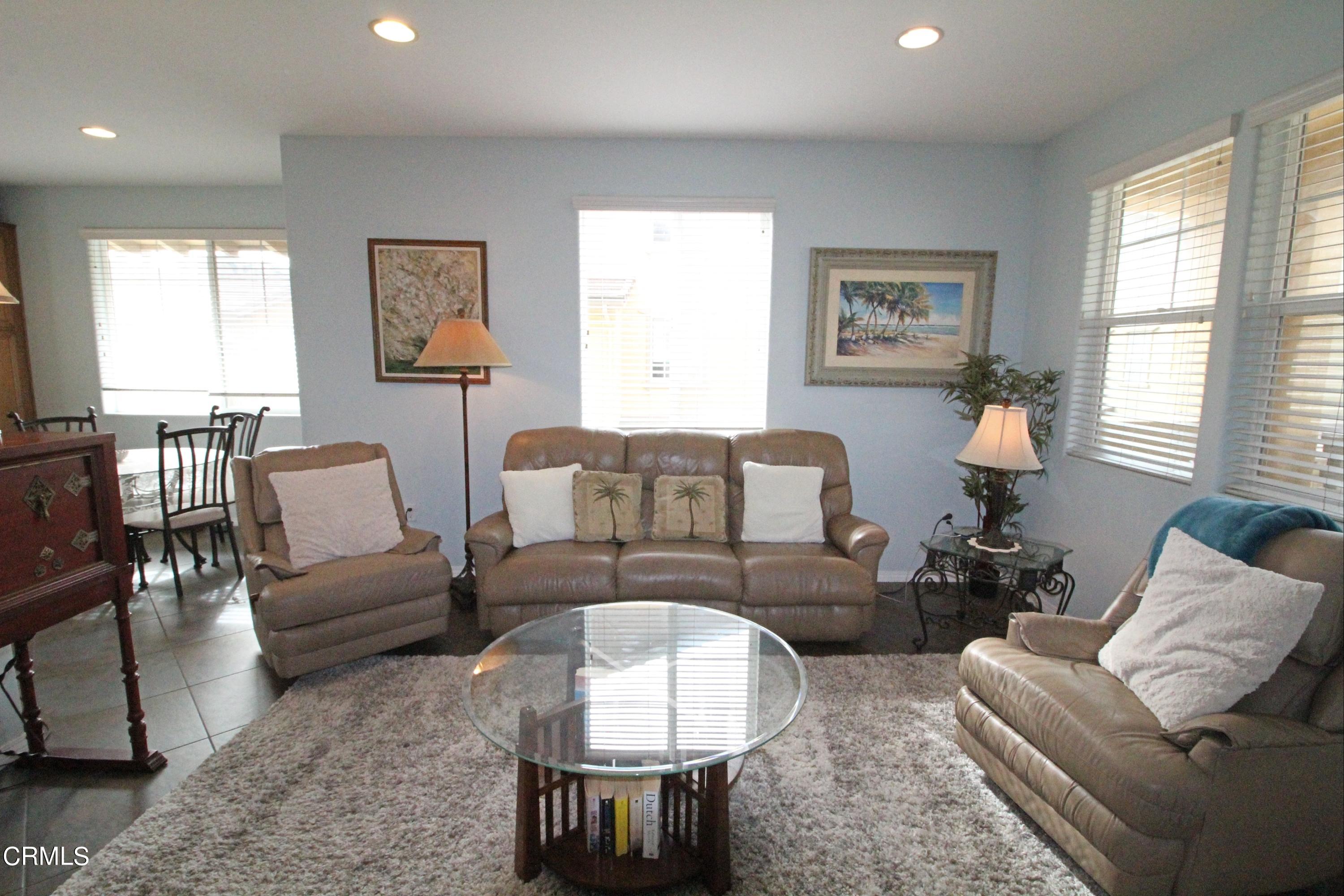 1428 Windshore Way Oxnard, CA 93035 - Photo 4 of 29 a living room with furniture a bed and a couch