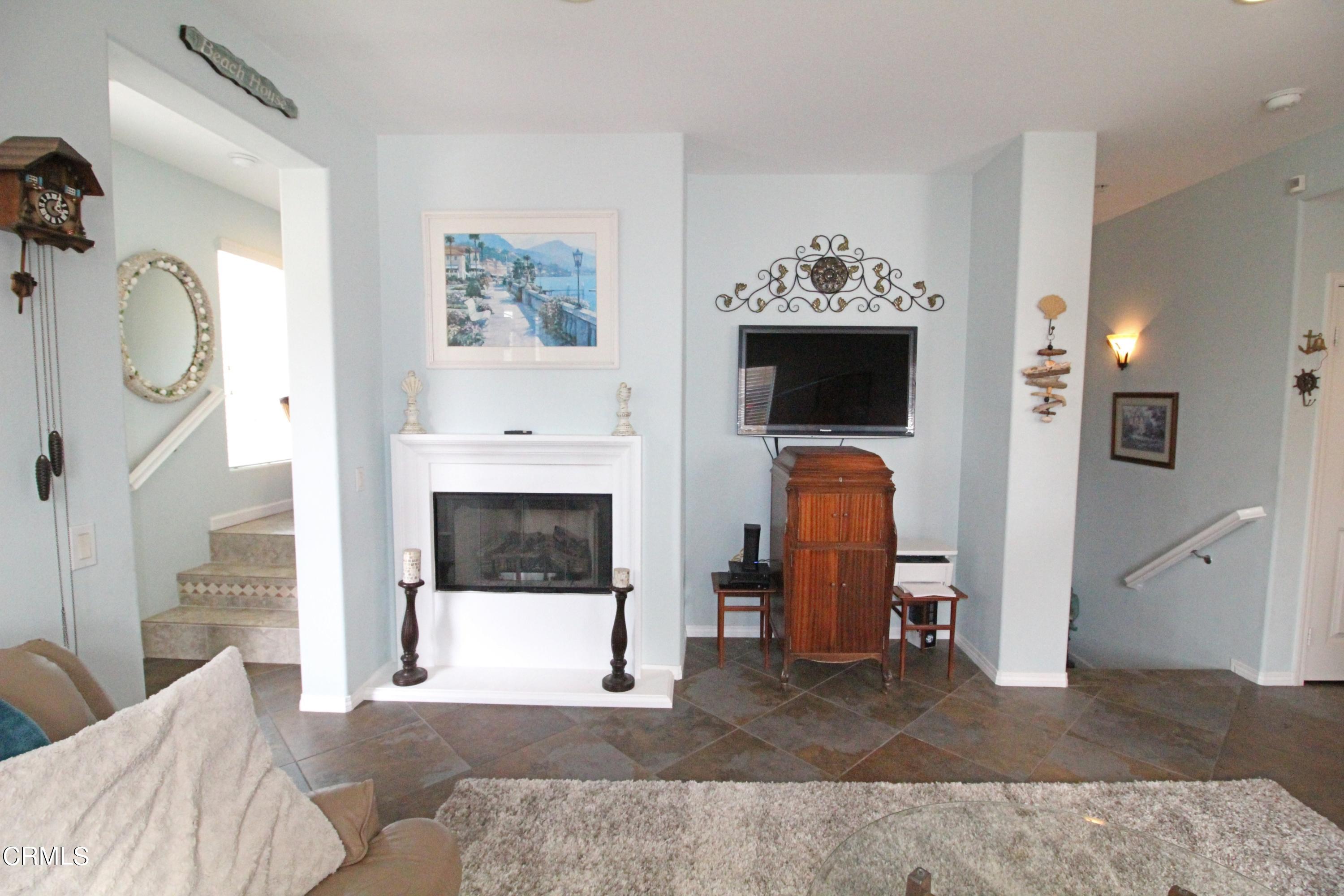 1428 Windshore Way Oxnard, CA 93035 - Photo 5 of 29 a living room with furniture and a fireplace