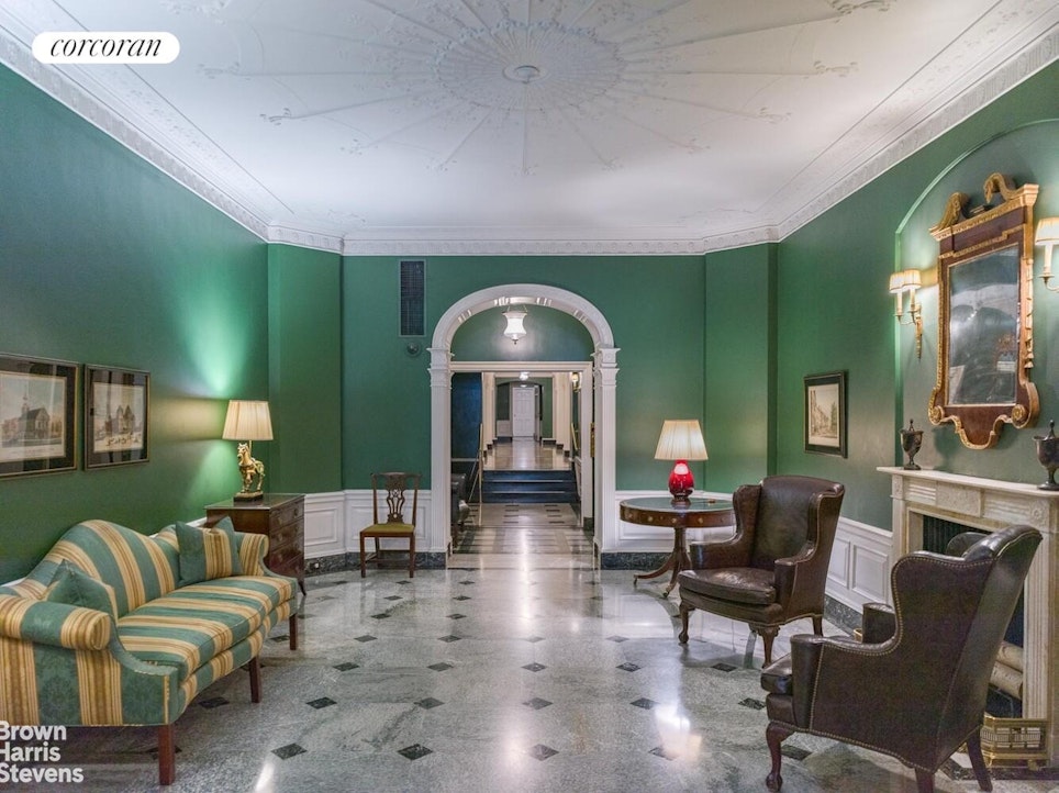 14 Sutton Place South, Unit 6F Manhattan, NY 10022 - Photo 11 of 14 a living room with furniture and a fireplace