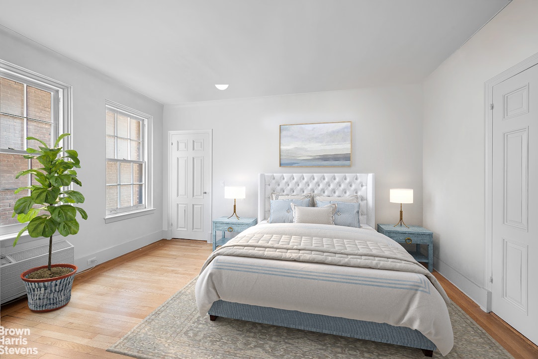14 Sutton Place South, Unit 6F Manhattan, NY 10022 - Photo 6 of 14 a bedroom with a large bed and a potted plant