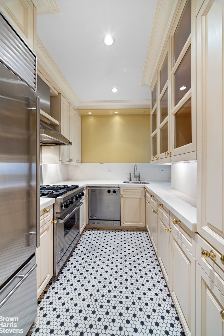14 Sutton Place South, Unit 6F Manhattan, NY 10022 - Photo 9 of 14 a kitchen with a sink a stove and refrigerator