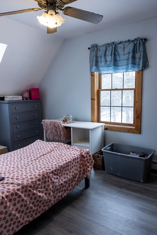 20 Paige Hill Road Brimfield, MA 01010 - Photo 33 of 40 a bedroom with a bed and chandelier