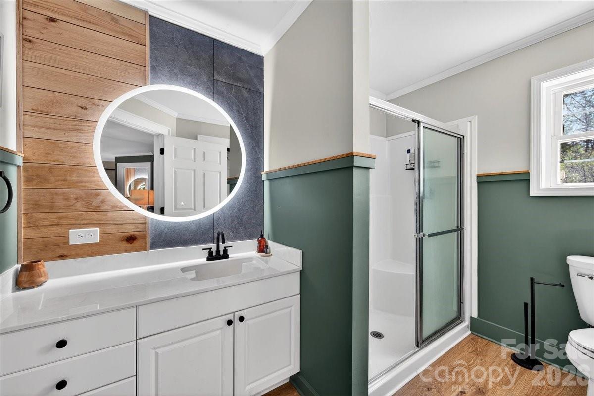 4624 South Olivers Cross Road Maiden, NC 28650 - Photo 22 of 48 a bathroom with a sink mirror and toilet