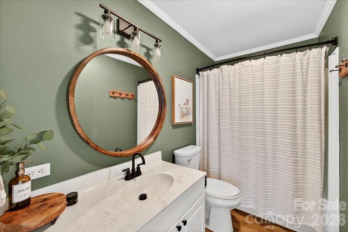 4624 South Olivers Cross Road Maiden, NC 28650 - Photo 24 of 48 a bathroom with a sink and a mirror