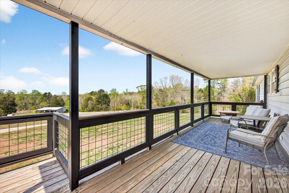 4624 South Olivers Cross Road Maiden, NC 28650 - Photo 5 of 48 a view of a balcony with wooden floor