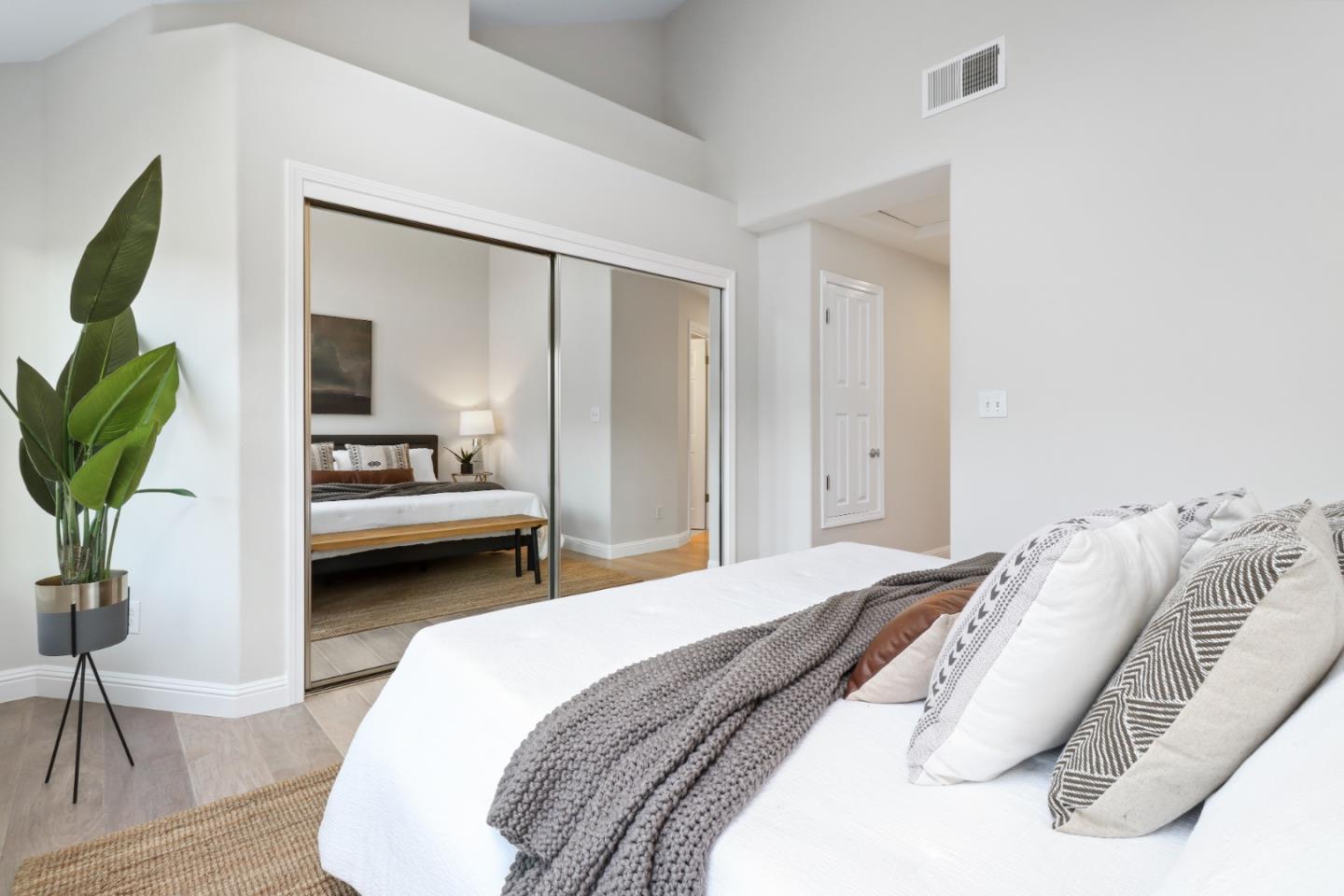 155 Pacchetti Way Mountain View, CA 94040 - Photo 22 of 35 a spacious bedroom with a bed and a couch