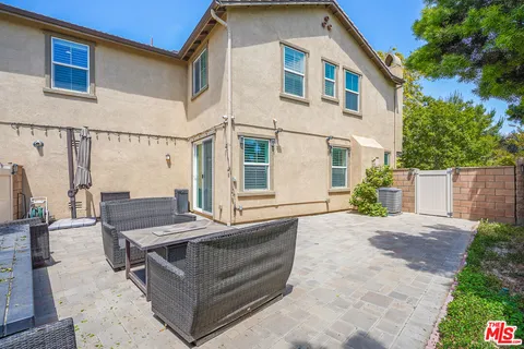 a outdoor space with a car park in front of it
