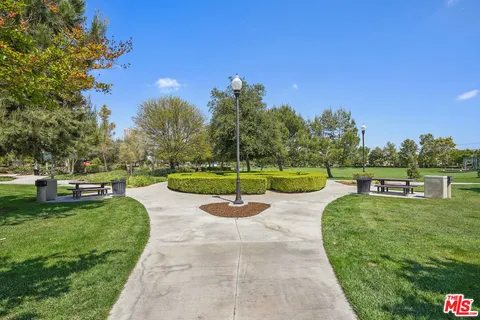 a view of a swimming pool with a yard