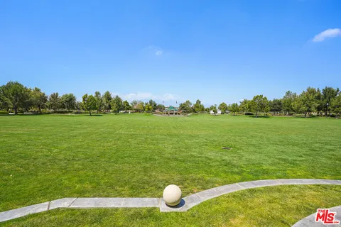 a view of a lake with a yard