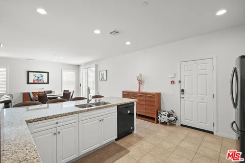 a spacious bathroom with a double vanity sink and a mirror
