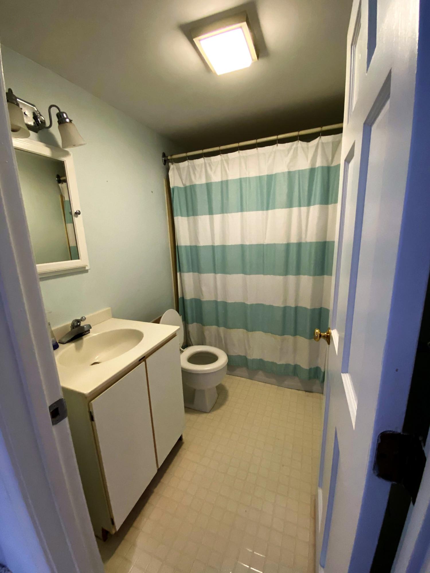 84 Nauset Heights Road Orleans, MA 02653 - Photo 17 of 24 a bathroom with a sink a toilet a mirror and shower