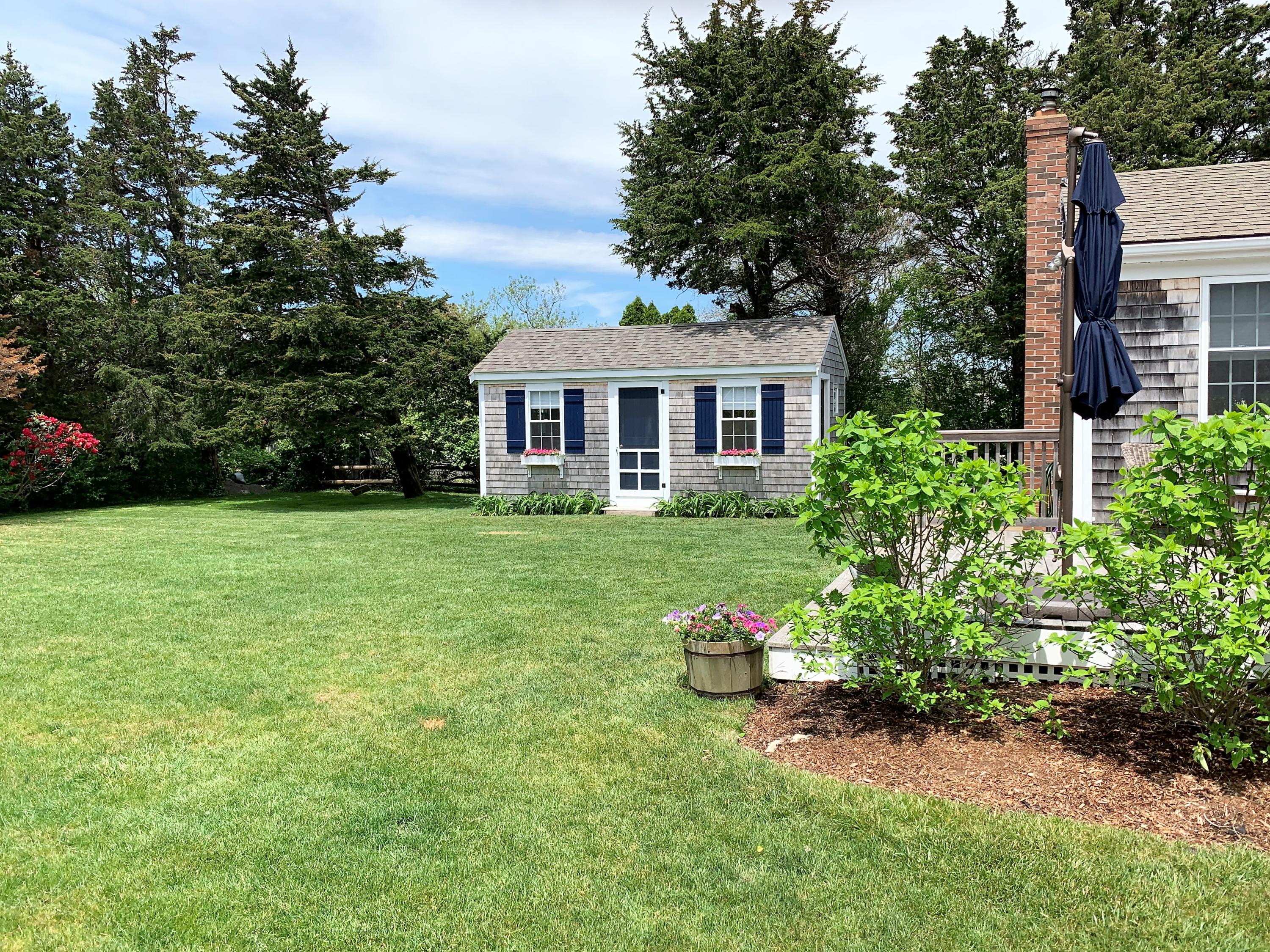 84 Nauset Heights Road Orleans, MA 02653 - Photo 3 of 24 a house that has a lot of plants in it
