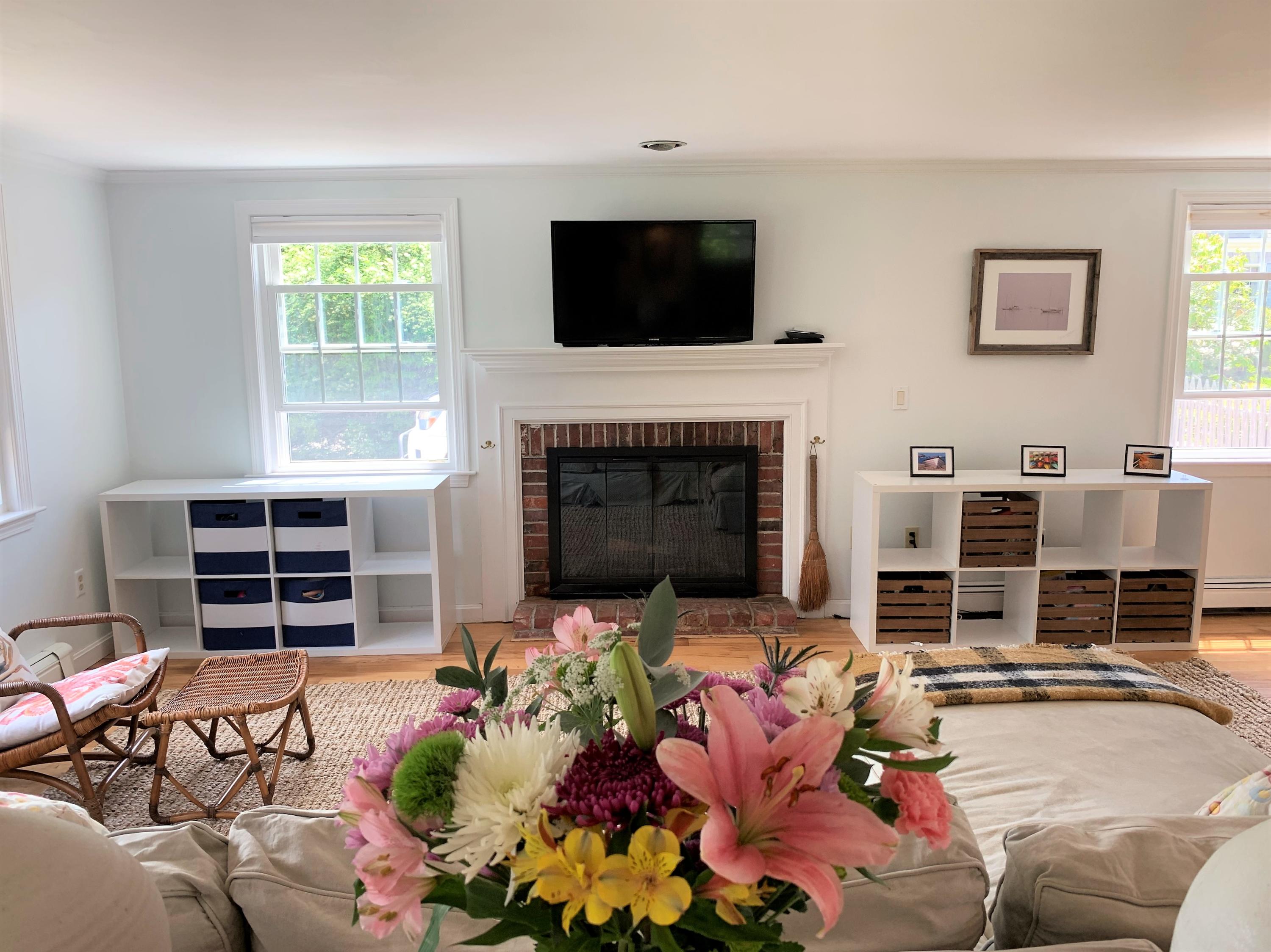 84 Nauset Heights Road Orleans, MA 02653 - Photo 6 of 24 a living room with furniture fireplace and flat screen tv