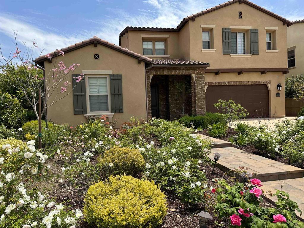 15529 Tanner Ridge Road San Diego, CA 92127 - Photo 1 of 1 a front view of a house with a yard and garage