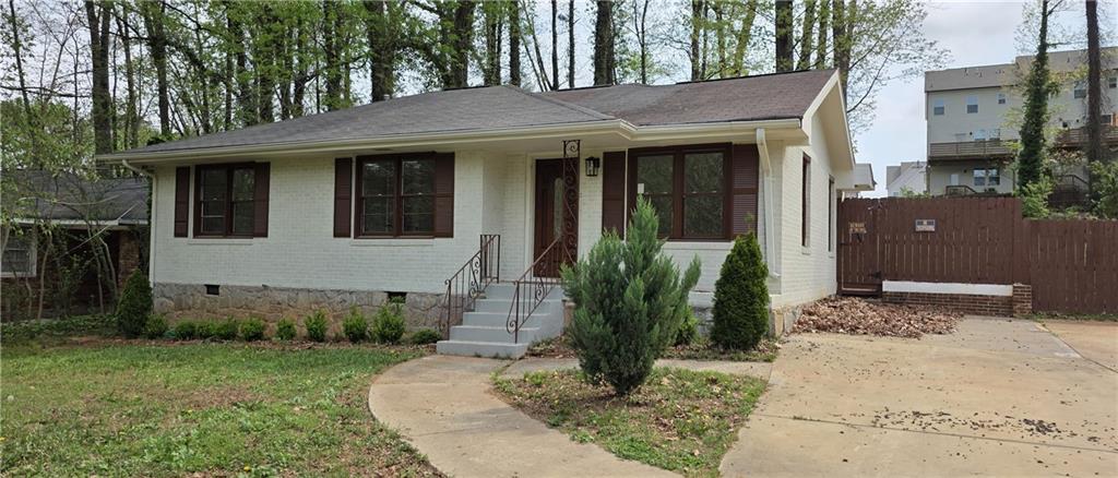 628 Farrar Court Avondale Estates, GA 30002 - Photo 1 of 17 a front view of a house with a yard