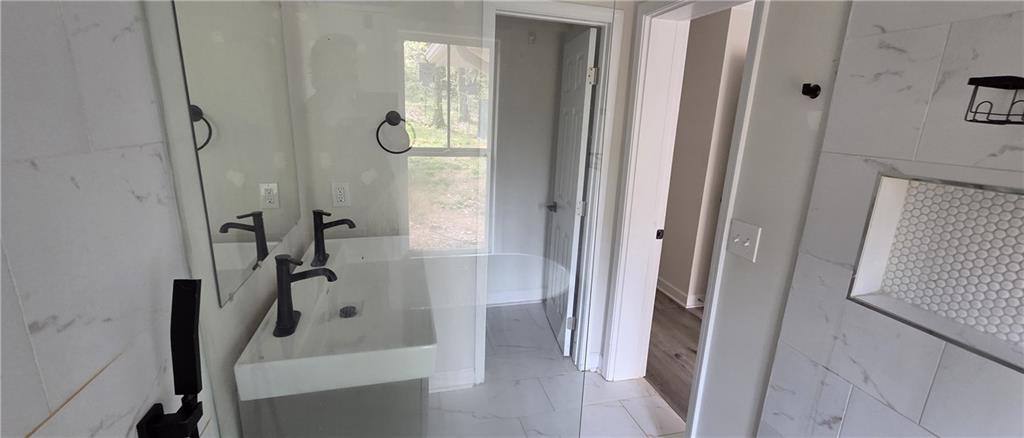 628 Farrar Court Avondale Estates, GA 30002 - Photo 14 of 17 a bathroom with a tub and shower
