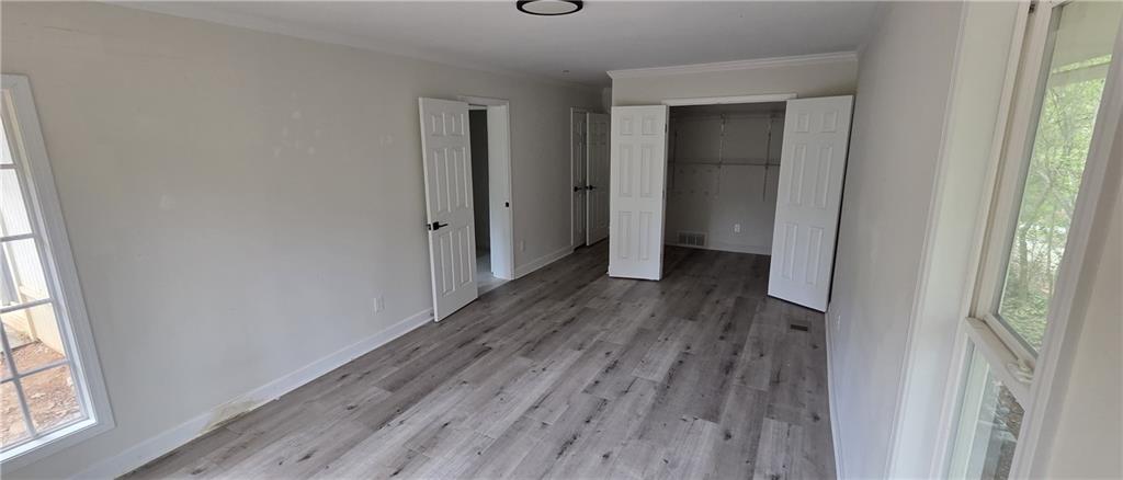 628 Farrar Court Avondale Estates, GA 30002 - Photo 16 of 17 a view of hallway with window and wooden floor