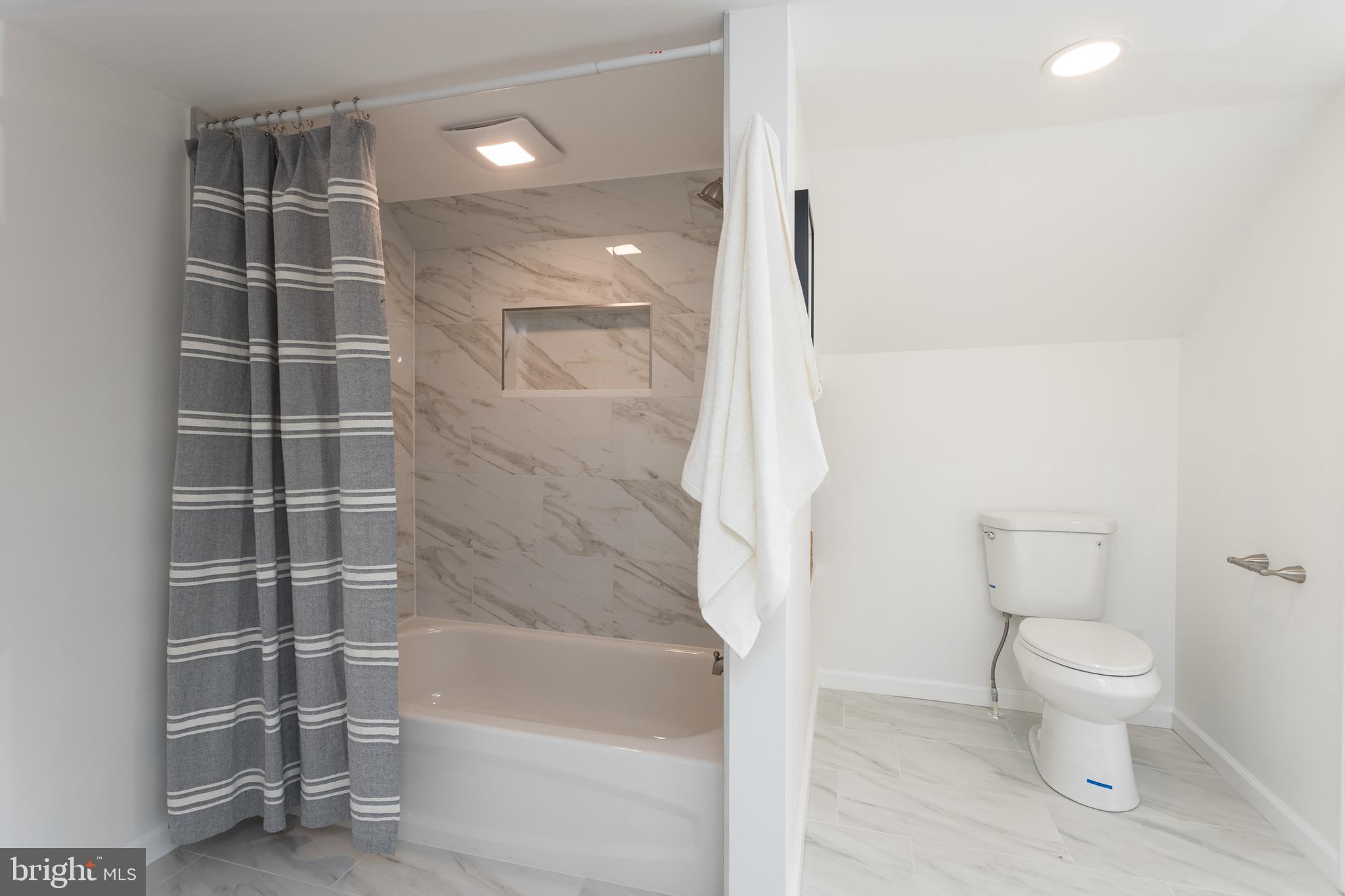 16742 Ridge Road Upperco, MD 21155 - Photo 28 of 38 a bathroom with a toilet and a shower