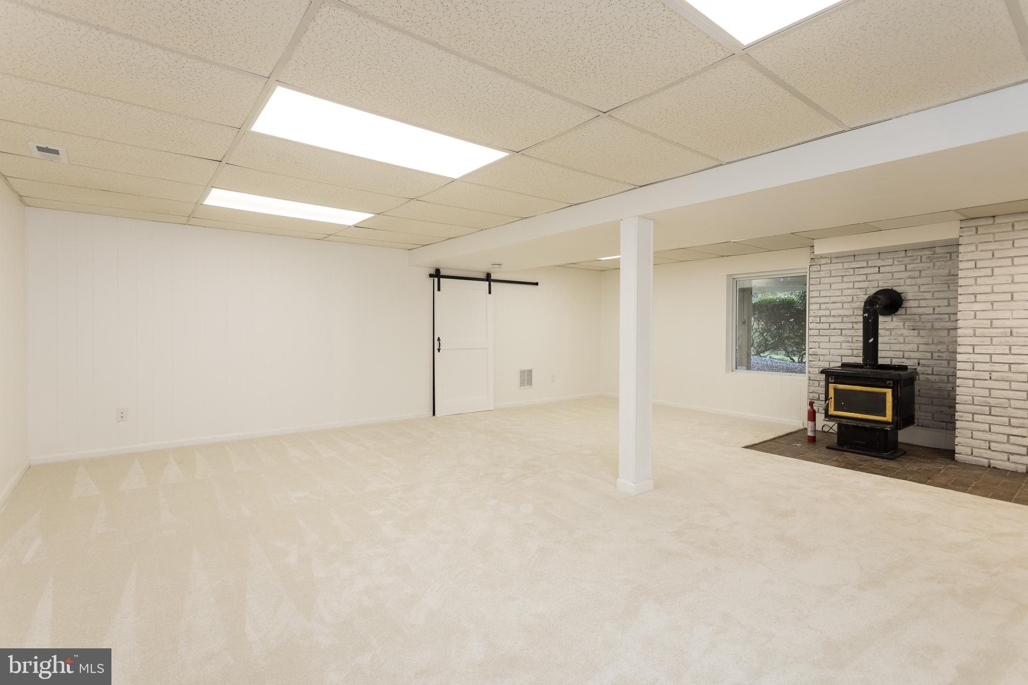 16742 Ridge Road Upperco, MD 21155 - Photo 29 of 38 a view of a livingroom with a fireplace and a chandelier