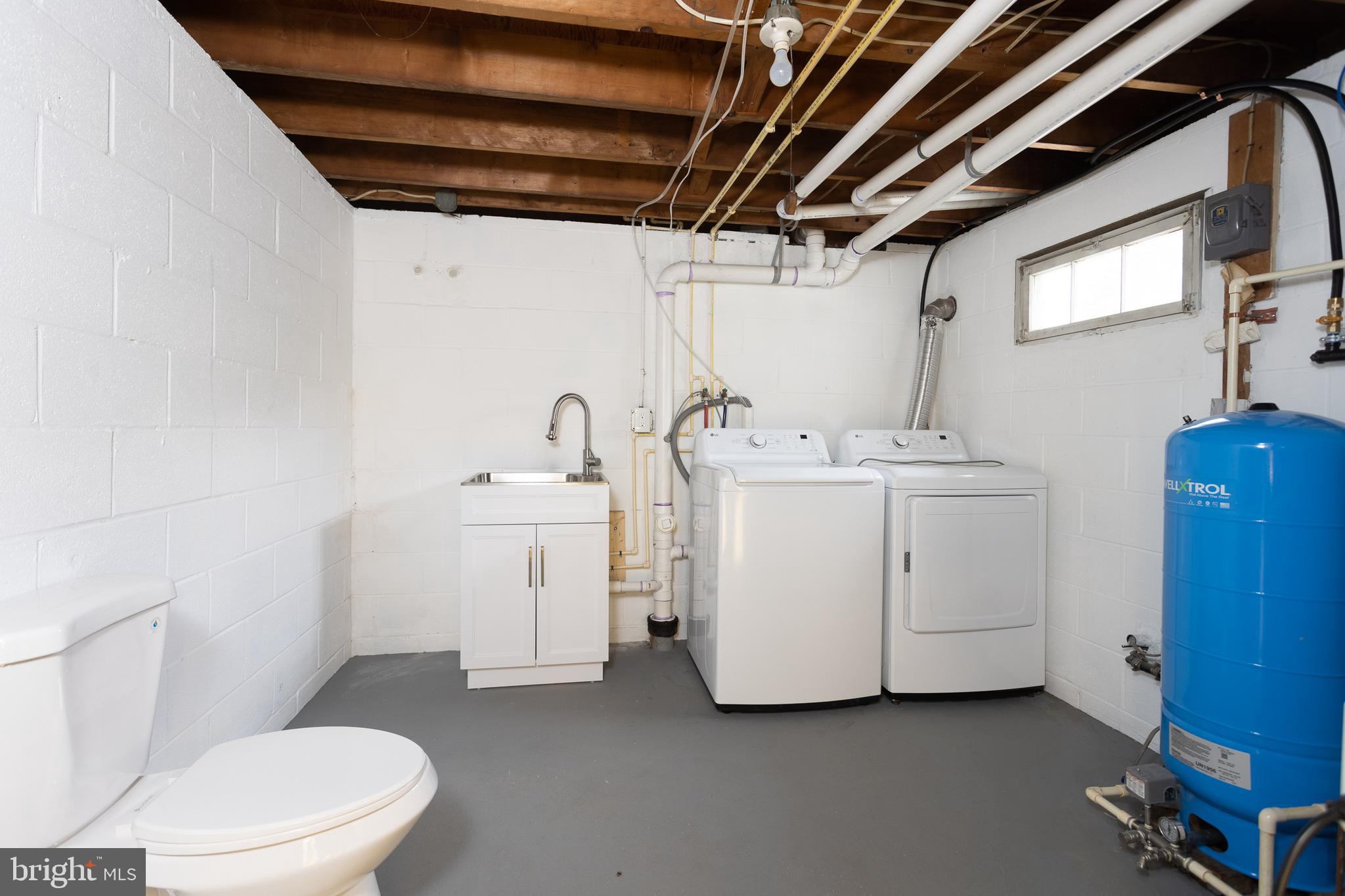 16742 Ridge Road Upperco, MD 21155 - Photo 33 of 38 a white toilet sitting next to a bathroom sink