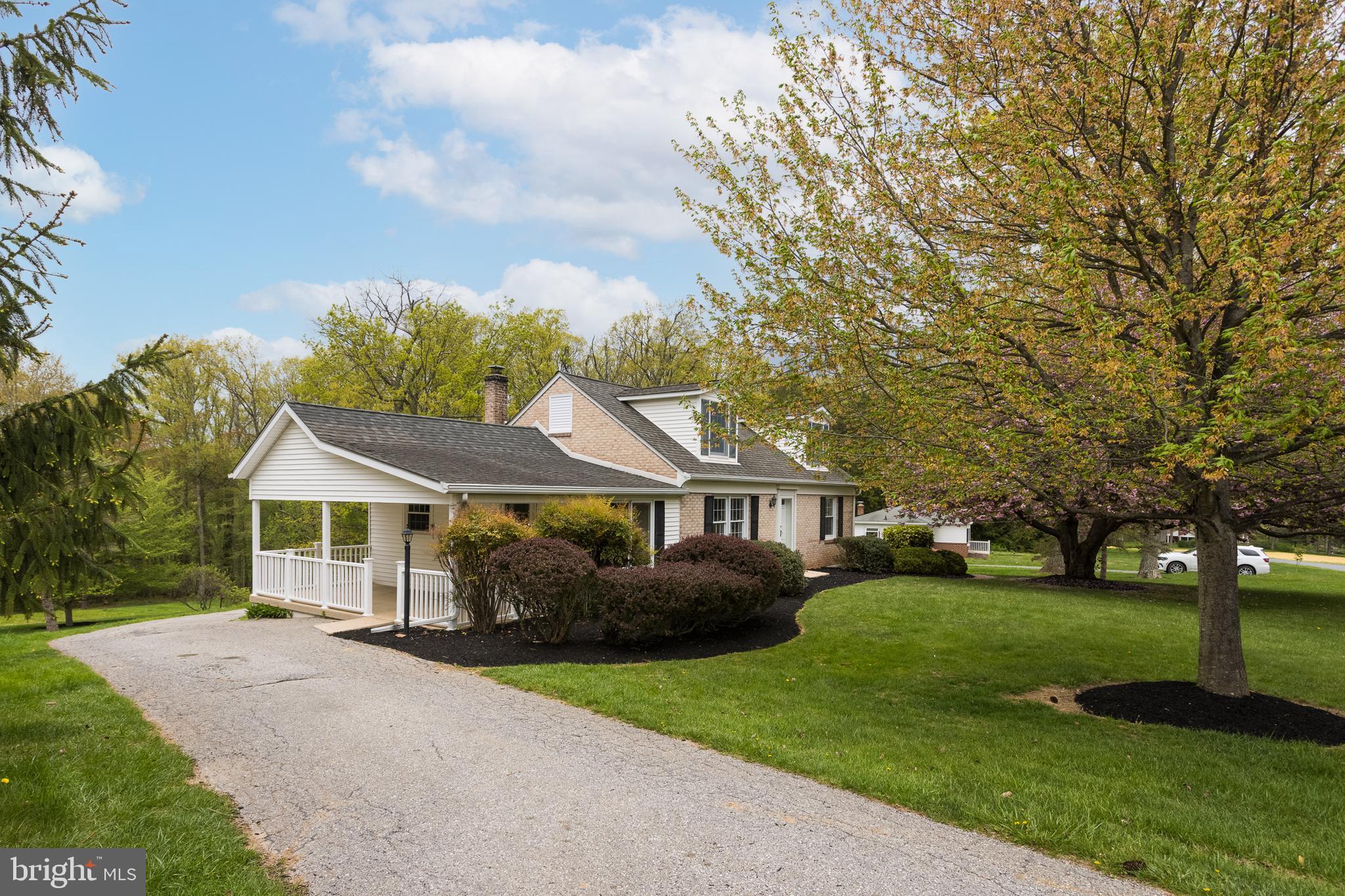 16742 Ridge Road Upperco, MD 21155 - Photo 37 of 38 a front view of a house with a garden