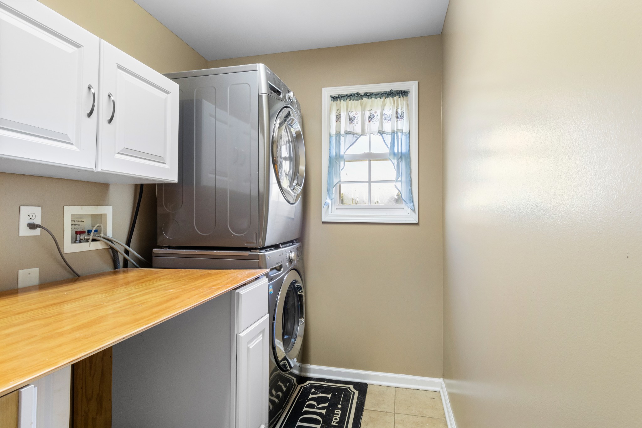 3382 Anderson Road Cedar Hill, TN 37032 - Photo 12 of 41 a room with blue cabinets and clock on the wall